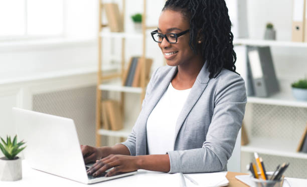 istock African American Office Girl Typing Something On Laptop At Work 1172139652