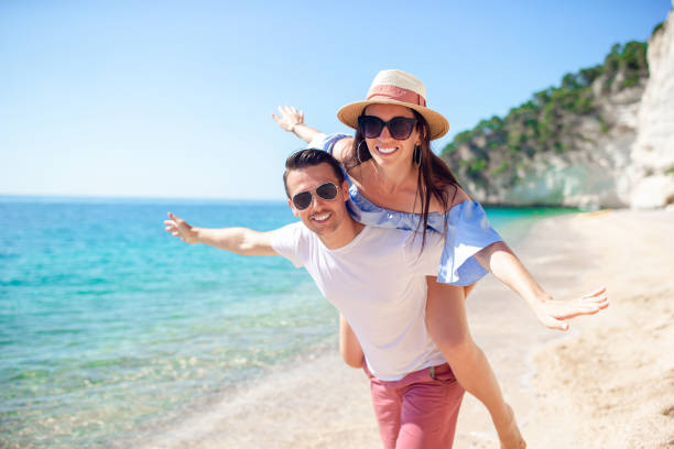 istock Young couple on white beach at summer vacation 1172139694