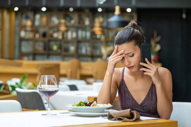 istock Desperate woman talking on phone in restaurant 1172139720