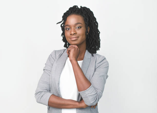 istock Afro Business Lady Touching Chin Smiling At Camera, White Background 1172140924