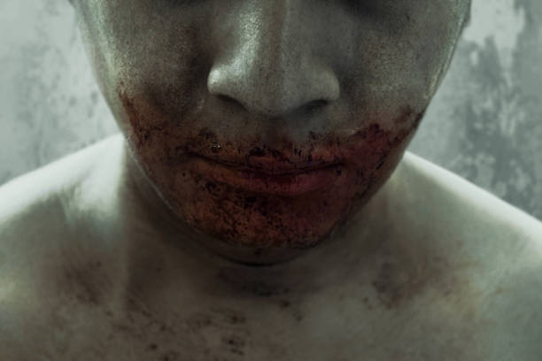 istock Close up of bloody mouth 1172141111