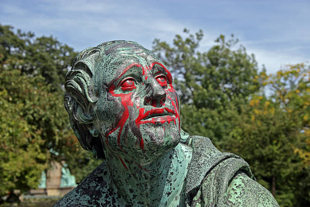 Statue covered with red paint. stock photo