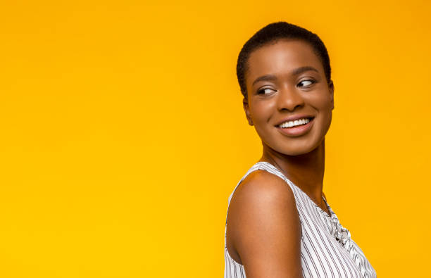 istock Gorgeous black lady looking at empty space over her shoulder 1172141826