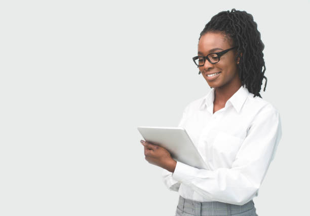 istock African American Woman Reading Something On Tablet Computer In Studio 1172141910