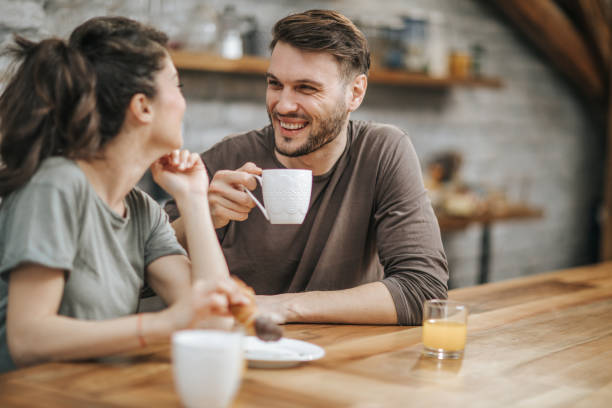 istock Happy couple talking during morning coffee at home. 1172142412
