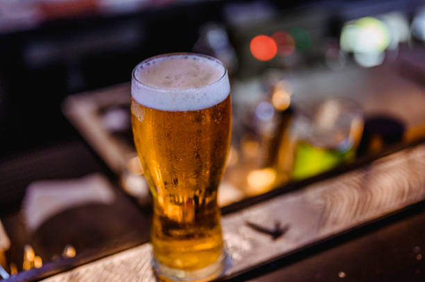 istock Glass of light beer on a bar. 1172143138