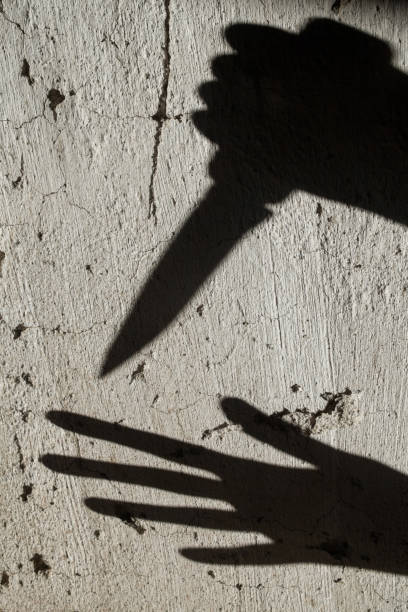istock Shadows. Criminal and victim. 1172143463