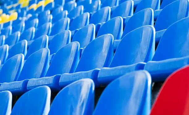 Photo of empty stadium chairs background