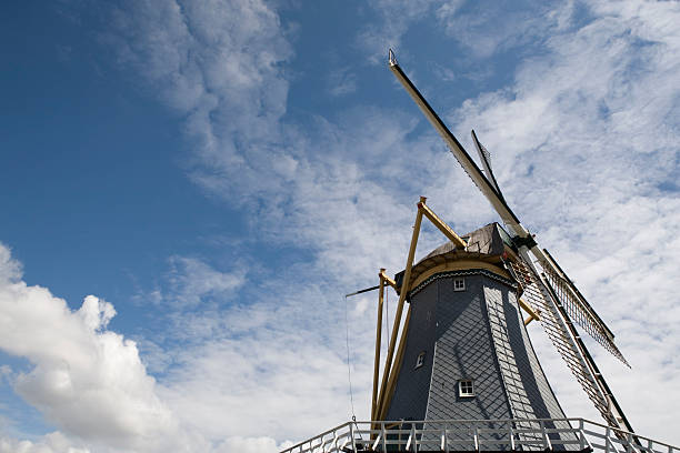 traditional Dutch windmill against a partly clouded sky; 's-Gravenzande, Netherlands
