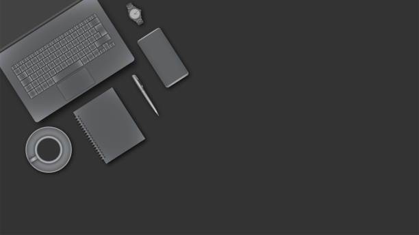 istock View from above of working desk with business devices. 1172148536