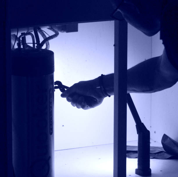 istock Plumber installing hot water tank 1172149187