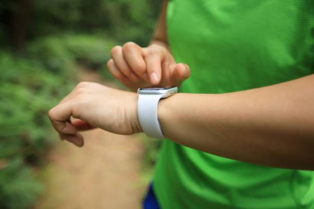 istock Ultra marathon runner looking smart watch 1172152245
