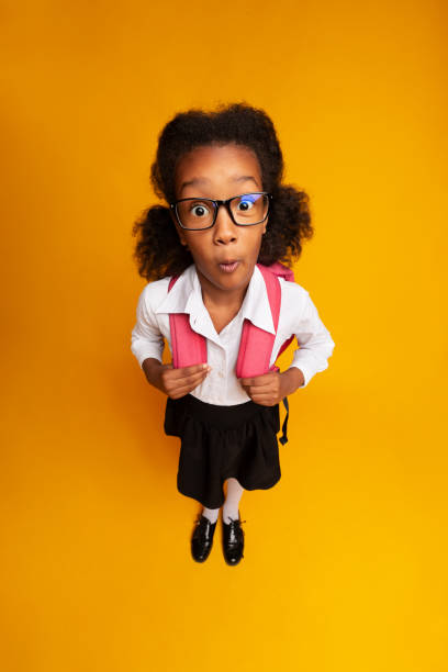 istock Shocked Afro Schoolgirl Looking At Camera Posing In Studio, High-Angle 1172152291