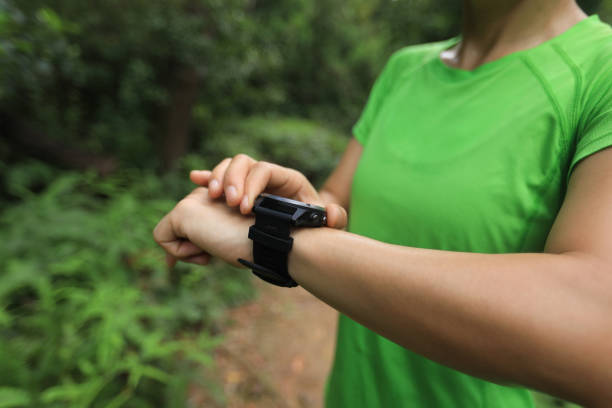 istock Ultra marathon runner looking smart watch 1172152380