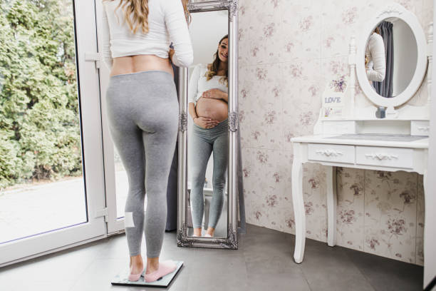 istock Pregnant woman at home 1172152436