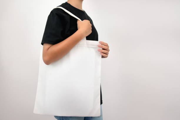istock hipter woman holding eco fabric bag isolate on white background 1172153819