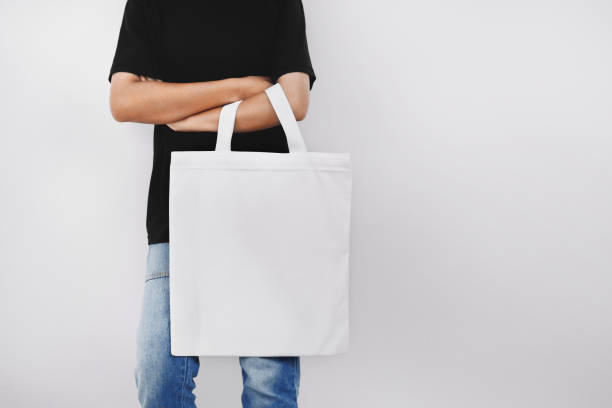istock hipter woman holding eco fabric bag isolate on white background 1172153826