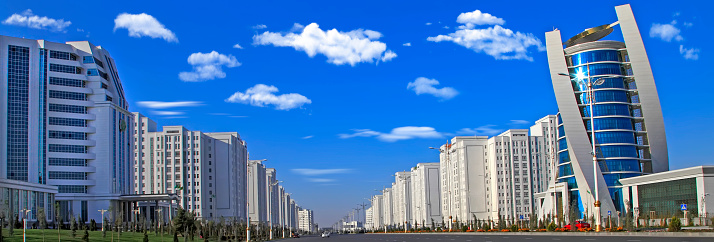 Ashgabat, Turkmenistan - October 15, 2015: Modern architecture of Ashgabat. Wide boulevard with some new buildings. Ashkhabad. Turkmenistan in October 15, 2015.
