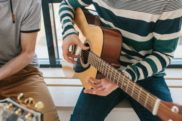 istock Learning to play the guitar. 1172155798