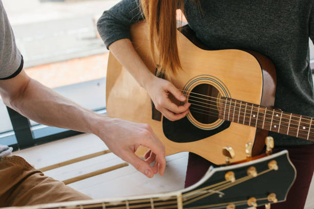 istock Learning to play the guitar. 1172155886