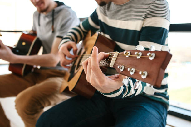 istock Learning to play the guitar. 1172158104