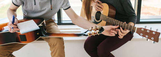 istock Learning to play the guitar. 1172159477
