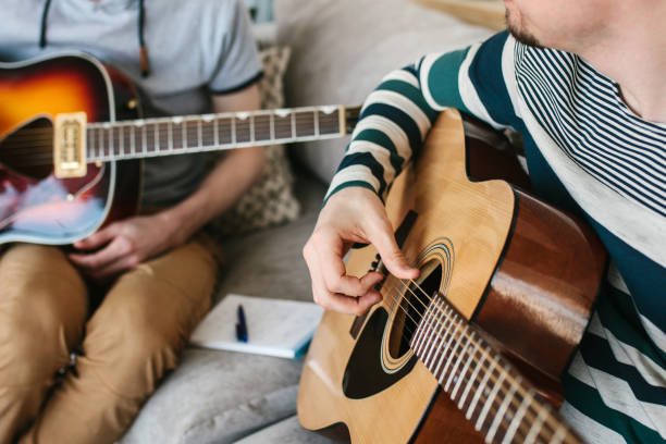 istock Learning to play the guitar. 1172159660