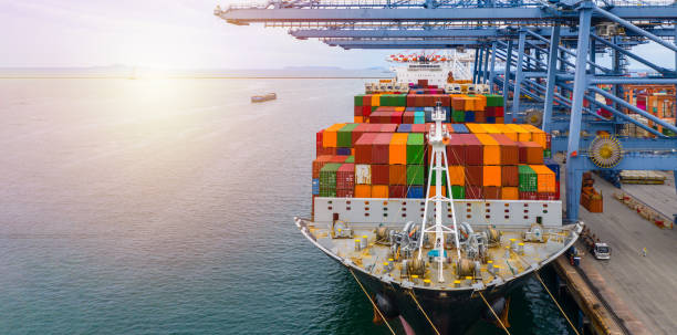 istock Container ship terminal, Unloading and loading crane of container ship at Industrial port with shipping containers. 1172160501