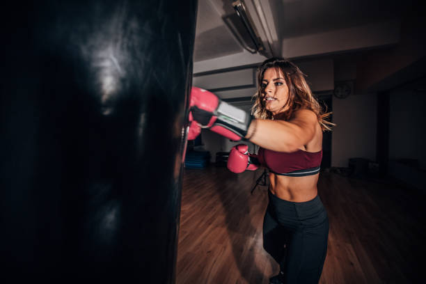 istock Woman training boxing in gym 1172160749
