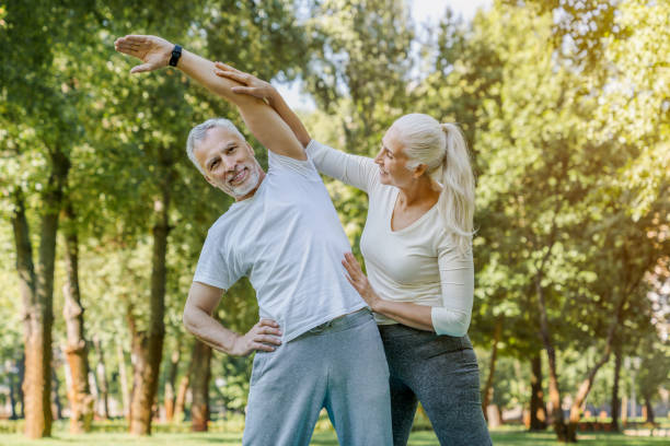 istock Active senior couple doing work out in park at morning 1172161362