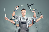 Funny portrait of a craftsman with 6 arms