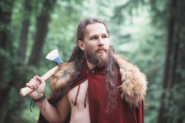 istock Handsome Warrior Viking man with iron axe outdoor 1172163922