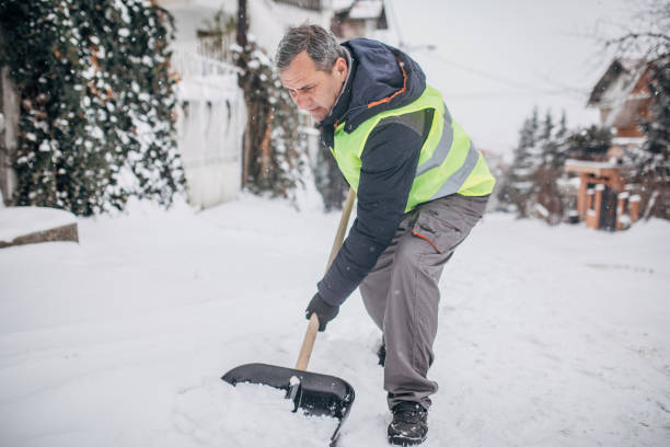 istock Man cleaning snow on the street 1172165184
