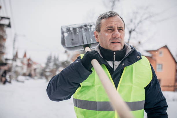 istock Senior man holding a snow shovel 1172166066
