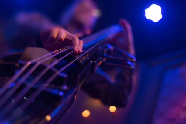 man playing double bass at a concert