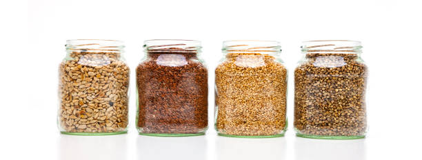 istock Seeds in glass on white background 1172169311