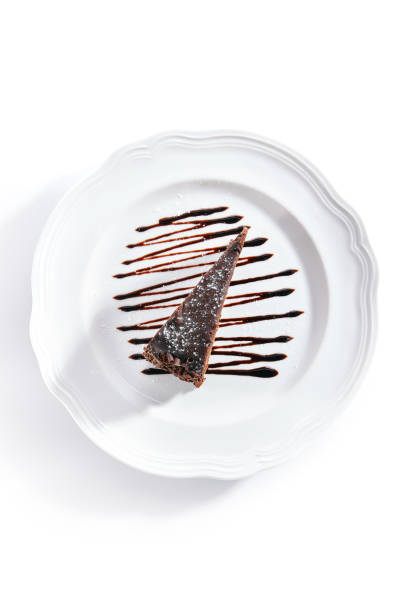 istock Chocolate Cake, Triangular Slice of Brown Biscuit Tart or Sachertorte 1172169508