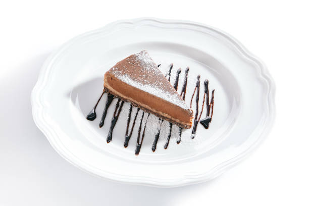 istock Macro Shot of Chocolate Cheesecake on White Plate Isolated 1172169546