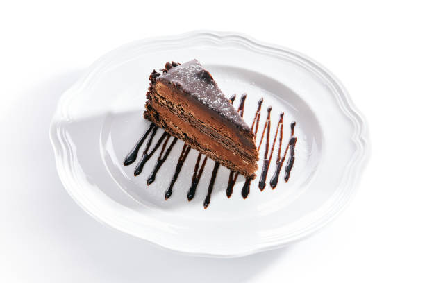 istock Chocolate Cake, Triangular Slice of Brown Biscuit Tart or Sachertorte 1172169558