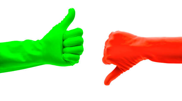 istock Thumbs up and down in rubber gloves 1172170058