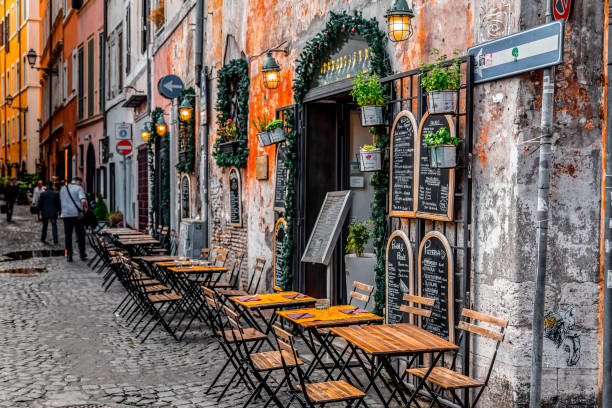 Rome, Italy - September 14 2022: Italian Restaurant Terrace at Trastevere District at Night in Rome, Italy