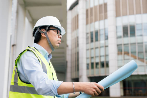 istock Asian businessman working in construction site. Engineering and business concept. 1172170251
