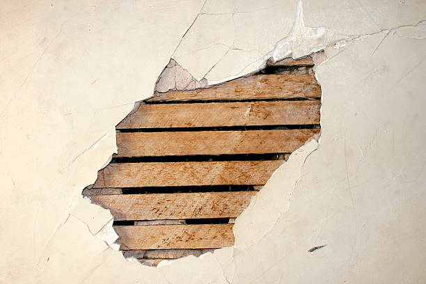 istock Hole in the Wall - Cracked Plaster 117217199