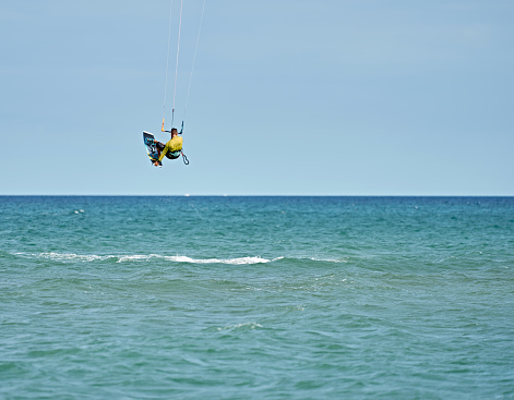 Kitesurfer Sailing on the sea