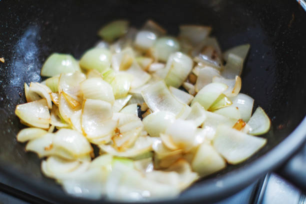 Preparing meal in frying pan