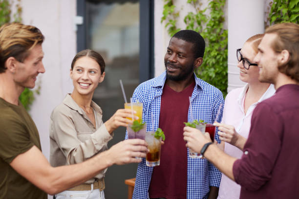 istock Multi-Ethnic Group of Friends Enjoying Drinks at Party 1172176486