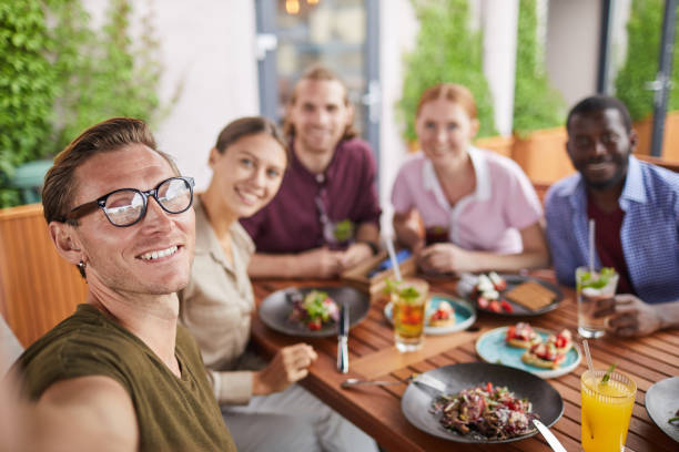 istock Young People Taking Selfie Photo in Cafe 1172176505