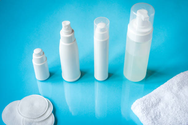 istock White bottles with skin lotion on a blue background 1172176683