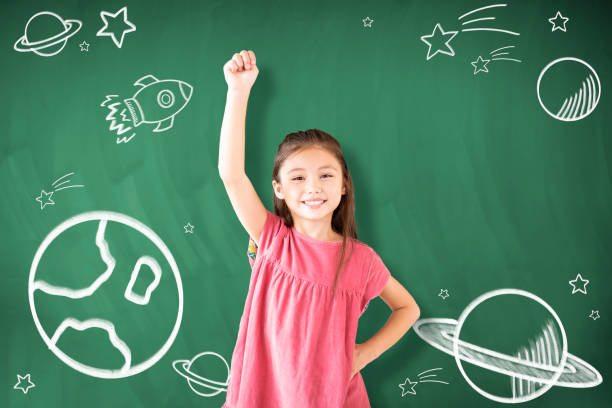 istock happy little girl Dreaming to explore space concepts 1172177302