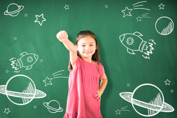 istock happy little girl Dreaming to explore space concepts 1172177303